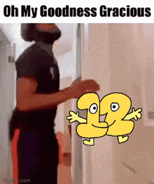 a man with a beard is standing in a hallway next to a cartoon character with the number 22 on it .