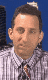 a man in a plaid shirt and tie is making a funny face