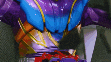 a close up of a purple and blue superhero costume