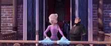 a woman in a purple dress is standing next to a man in a suit