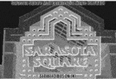 a black and white photo of sarasota square mall commercial jingle