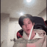 a man sitting in a chair with the words " is in moments that act on a body that are at rest "