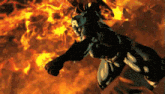 a man in a captain america costume is flying through a fire