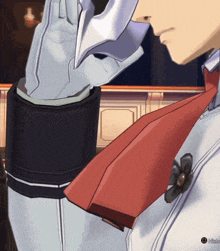 a man wearing a white glove and a red tie with a button that says history