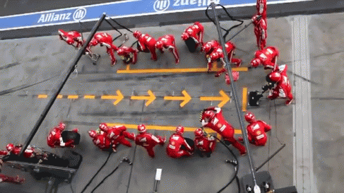 A gif of a race car pulling into a pit stop