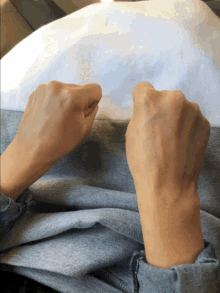 a close up of a person 's hands holding something