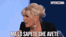 a woman in a black jacket says " ma lo sapete che avete "
