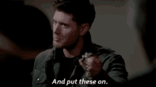 Supernatural Dean Winchester GIF - Supernatural Dean Winchester Put These On GIFs