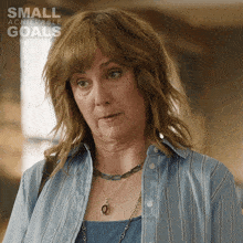 a woman with small achievable goals written on the bottom right