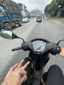 a person is riding a honda scooter on a street
