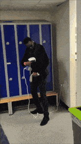 a man in a suit is standing in a locker room