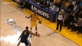 a basketball player wearing number 24 dribbles the ball