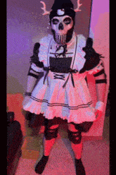 a person in a maid dress with a hello kitty hat on their head