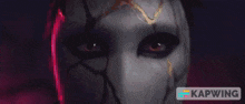 a close up of a person 's face with the word kapwing on the bottom right