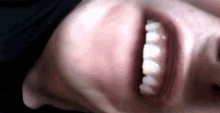 a close up of a person 's mouth and teeth