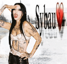 a woman with a lot of tattoos stands in front of sybau