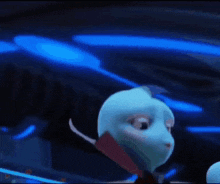 a couple of blue cartoon characters are standing next to each other .