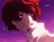 a close up of a person with red hair and a white shirt