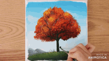 a person is painting a tree on a canvas made in animatica