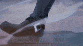 a cartoon drawing of a person 's foot with a sword
