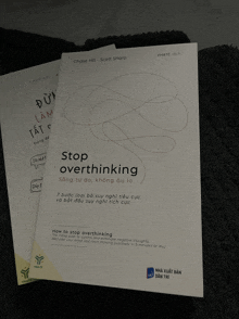 a book titled stop overthinking sits on a carpet