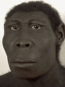 a close up of a man 's face with a very serious look on his face