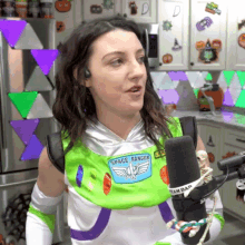 a woman dressed in a space ranger costume holds a microphone