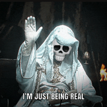 a skeleton in a white robe with the words i 'm just being real below him