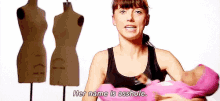 a woman is holding a pink baby and says her name is asshole .
