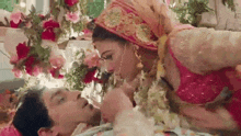 a bride and groom kissing on their wedding day .