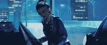 a pixelated image of a woman standing next to a black car