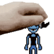 a hand is holding a pixel art character on top of a white background .