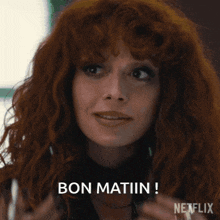 a woman with red hair is holding a pair of glasses and says bon matin on the bottom
