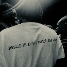 jesus is alive catch the vision written on the back of a white shirt