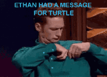 a man in a green shirt with the words ethan had a message for turtle on the bottom