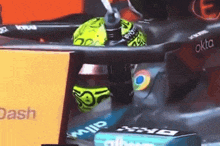 a close up of a race car with the word okta on it
