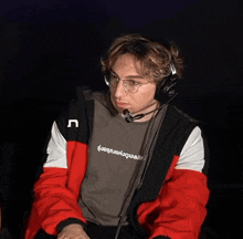 a man wearing headphones and a t-shirt that says " u " on it