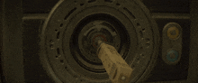 a close up of a circular object with a blue light in the center