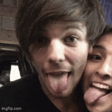a man sticking his tongue out next to another man with his tongue hanging out