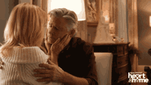 a super channel ad for heart & frame shows a man and a woman hugging