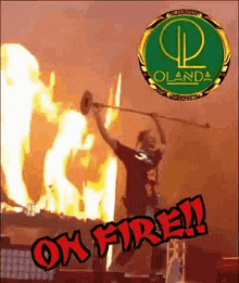 a man is playing a trumpet in front of a burning building with the words ok fire on the bottom .