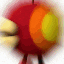 a blurred image of a red orange and yellow circle