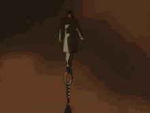 a man in a green coat is standing in the dark