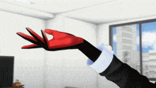 a person wearing a red and black glove is reaching out