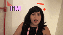 a woman says i 'm in front of a white wall