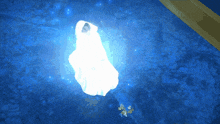 a person in a white robe is floating in a blue pool