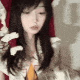 a woman with long hair is holding a bunch of toilet paper