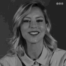 a black and white photo of a woman 's face is surrounded by diagonal stripes