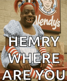 a wendy 's sign is behind a person dressed as wendy