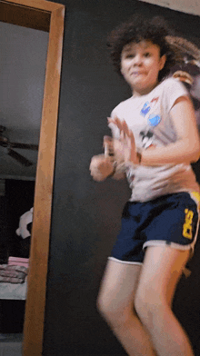 a girl wearing shorts that say ds on them